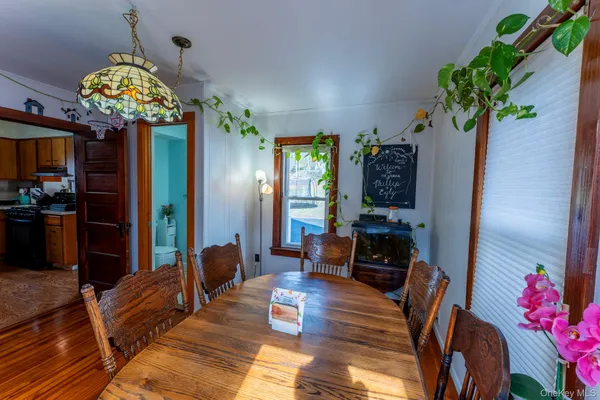 a living room with furniture chandelier and a chandelier