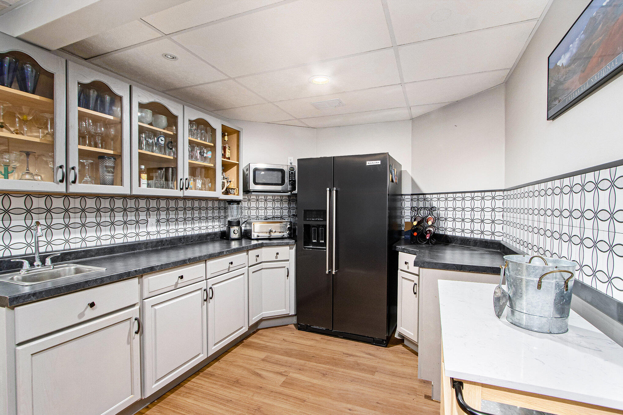 15570 Portage Road Vicksburg, MI 49097 - Photo 34 of 52 lower level kitchenette/bar
