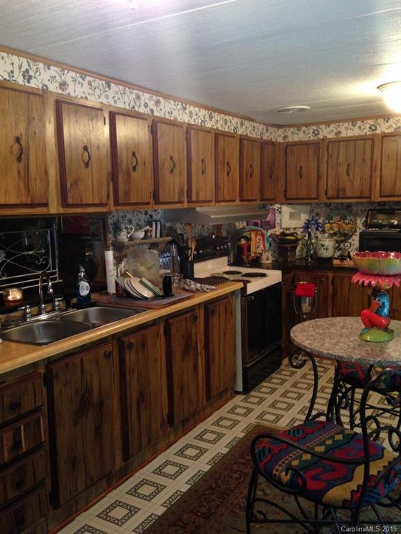 327 Rutledge Road Mount Holly, NC 28120 - Photo 2 of 14 a kitchen with a sink and cabinets