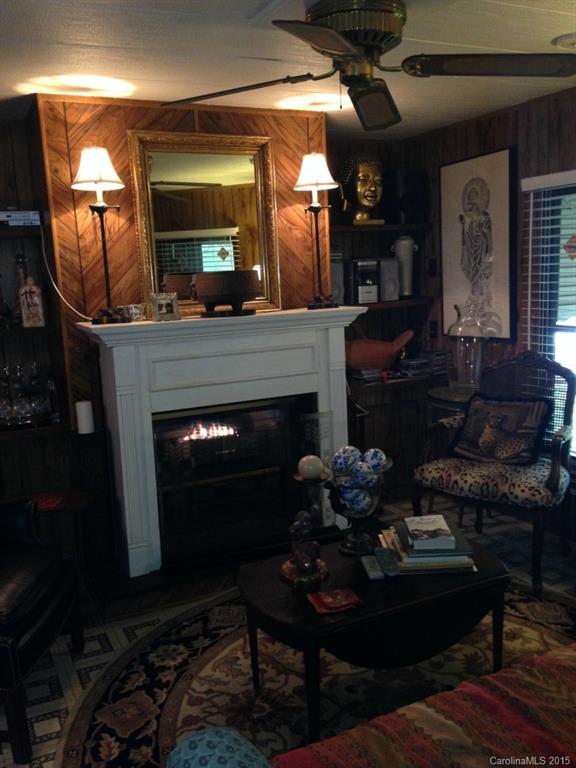 327 Rutledge Road Mount Holly, NC 28120 - Photo 11 of 14 a living room with furniture and a fireplace