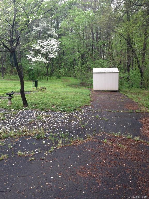 327 Rutledge Road Mount Holly, NC 28120 - Photo 14 of 14 a view of a forest with large trees