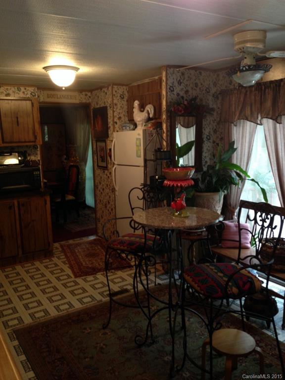 327 Rutledge Road Mount Holly, NC 28120 - Photo 3 of 14 a view of a dining room with furniture window and wooden floor