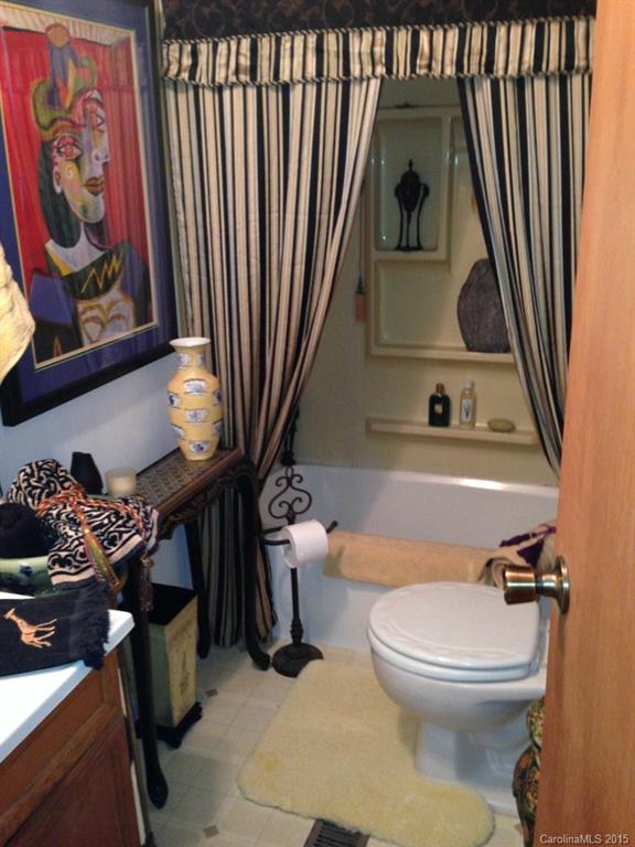 327 Rutledge Road Mount Holly, NC 28120 - Photo 8 of 14 a bathroom with a toilet a sink and a mirror