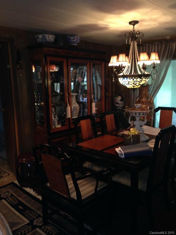 327 Rutledge Road Mount Holly, NC 28120 - Photo 9 of 14 a room with dining table and chairs