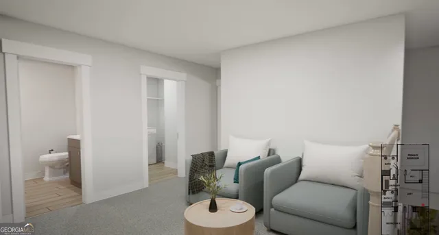 a living room with furniture and a toilet