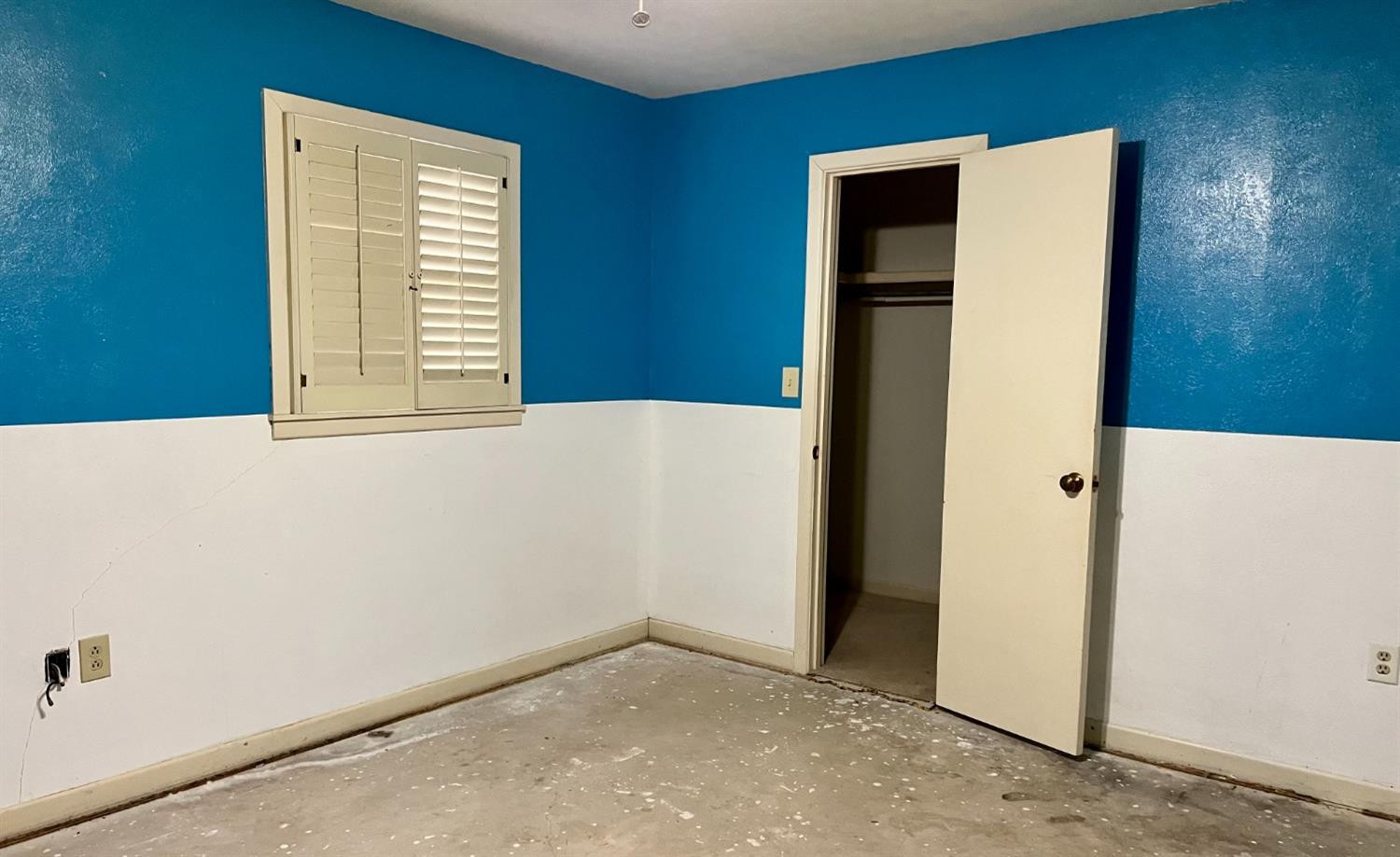 1415 Avenue North Ralls, TX 79357 - Photo 10 of 18 a view of an empty room with closet and a window