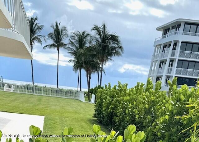 2580 South Ocean Boulevard, Unit 1A1 Palm Beach, FL 33480 - Photo 14 of 24 a view of a swimming pool with a garden
