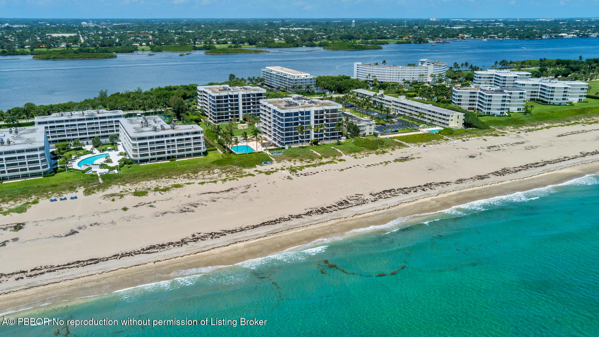 2580 South Ocean Boulevard, Unit 1A1 Palm Beach, FL 33480 - Photo 23 of 24 an aerial view of a house with a yard and outdoor seating
