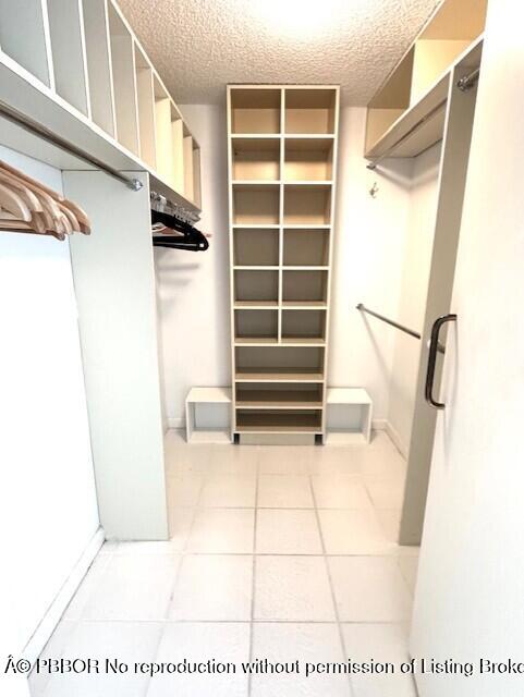2580 South Ocean Boulevard, Unit 1A1 Palm Beach, FL 33480 - Photo 9 of 24 a view of walk in closet with empty racks