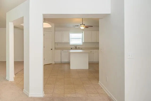 a bathroom with a bathtub sink and mirror