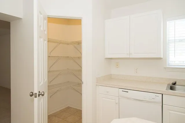 a kitchen with a sink and cabinets