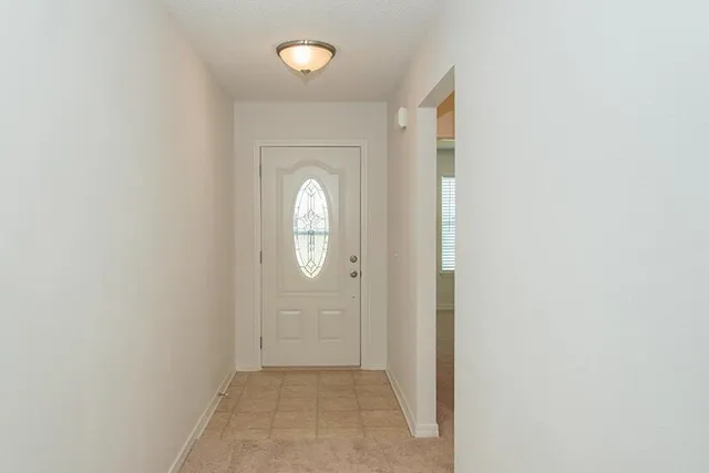 an empty room with mirror