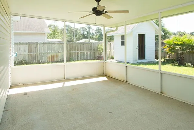 a view of an empty room with a window