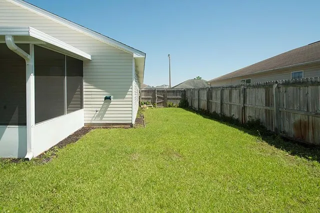 a view of a house with a garden