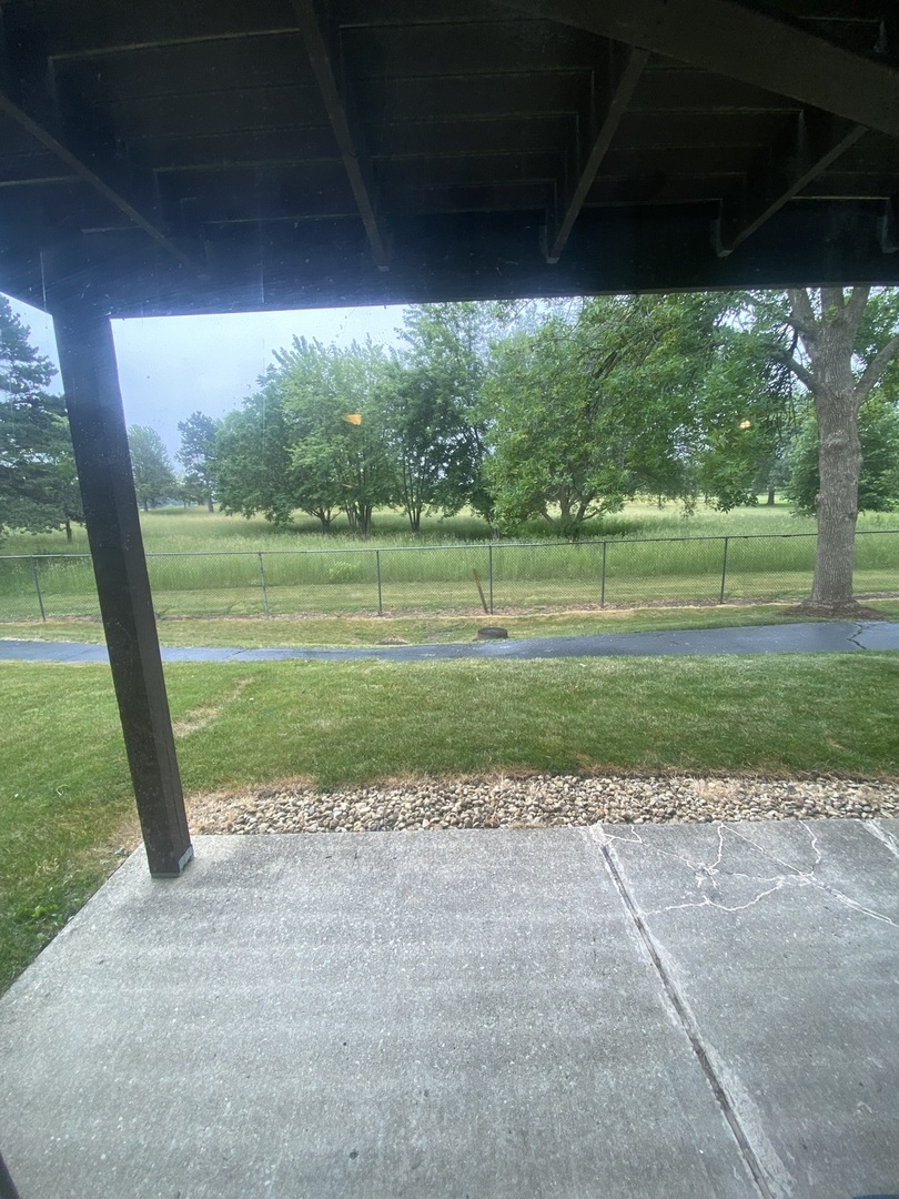 309 Memory Lane, Unit 1 Westmont, IL 60559 - Photo 19 of 23 a view of a golf course with a lake view