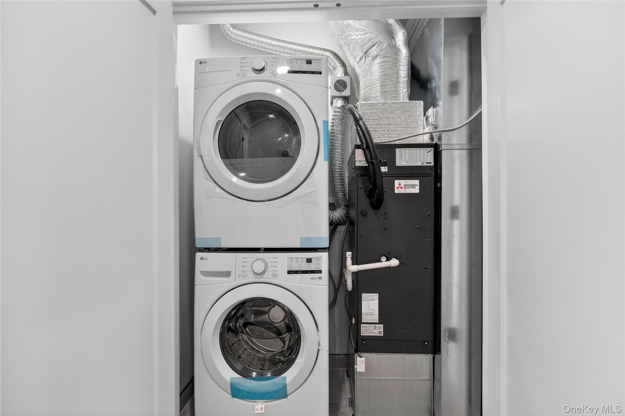 10 Market Street, Unit F Wappingers Falls, NY 12590 - Photo 6 of 14 a utility room with dryer and washer