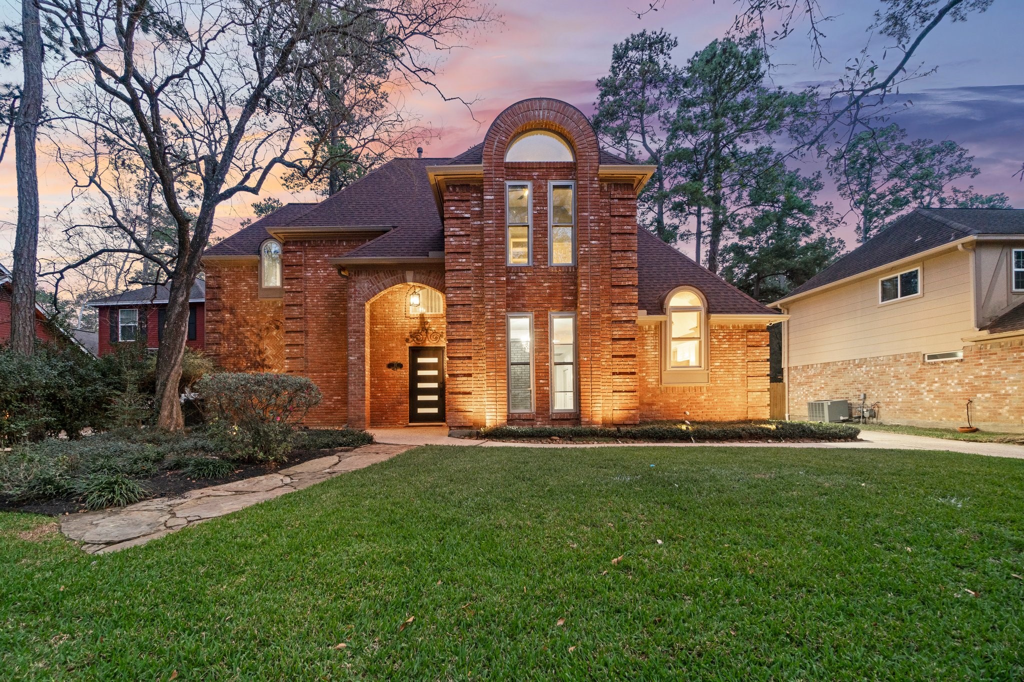 31 Tanager Trail The Woodlands, TX 77381 - Photo 1 of 48 a front view of a house with a yard