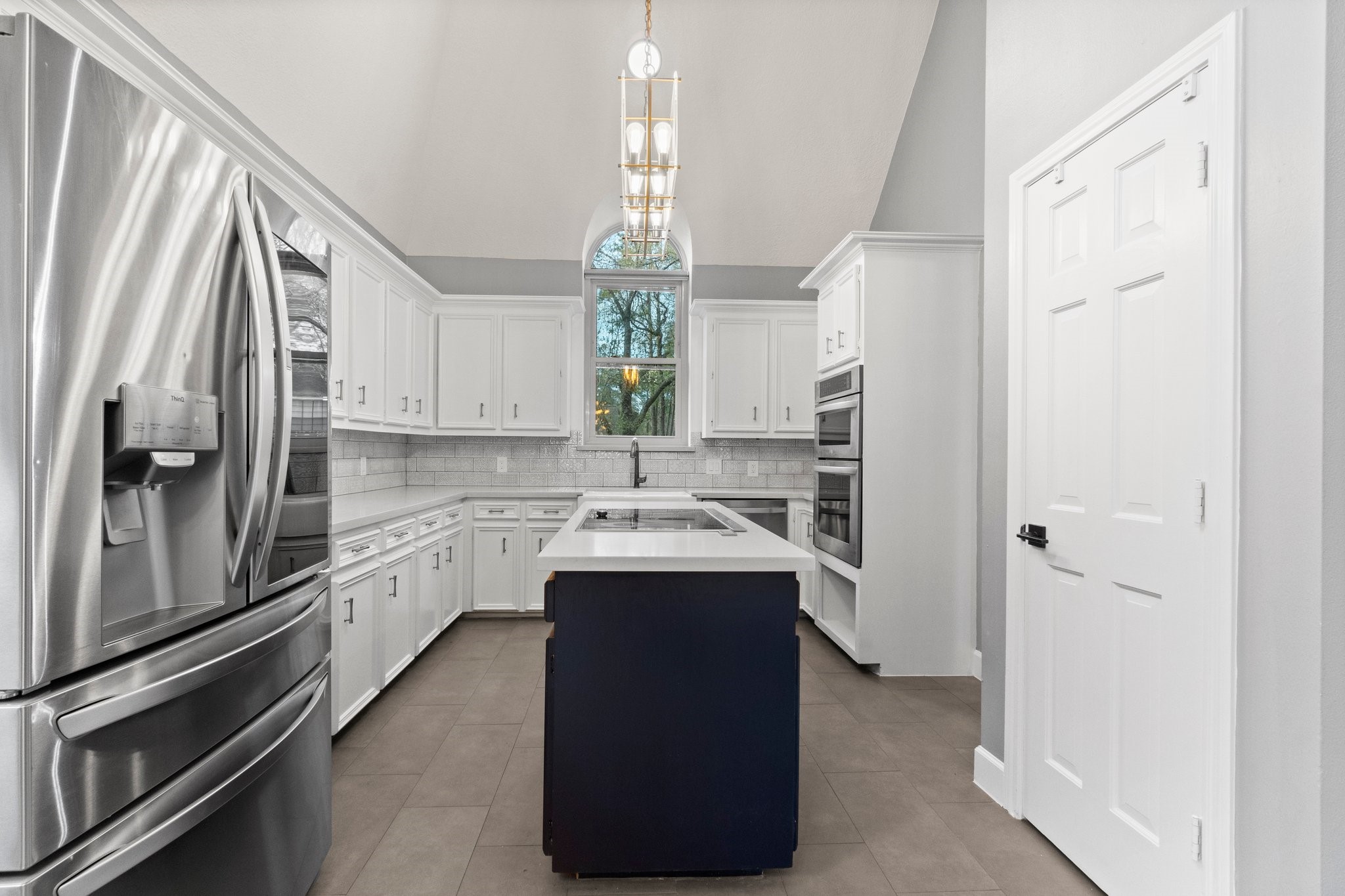 31 Tanager Trail The Woodlands, TX 77381 - Photo 11 of 48 a kitchen with a sink appliances and cabinets