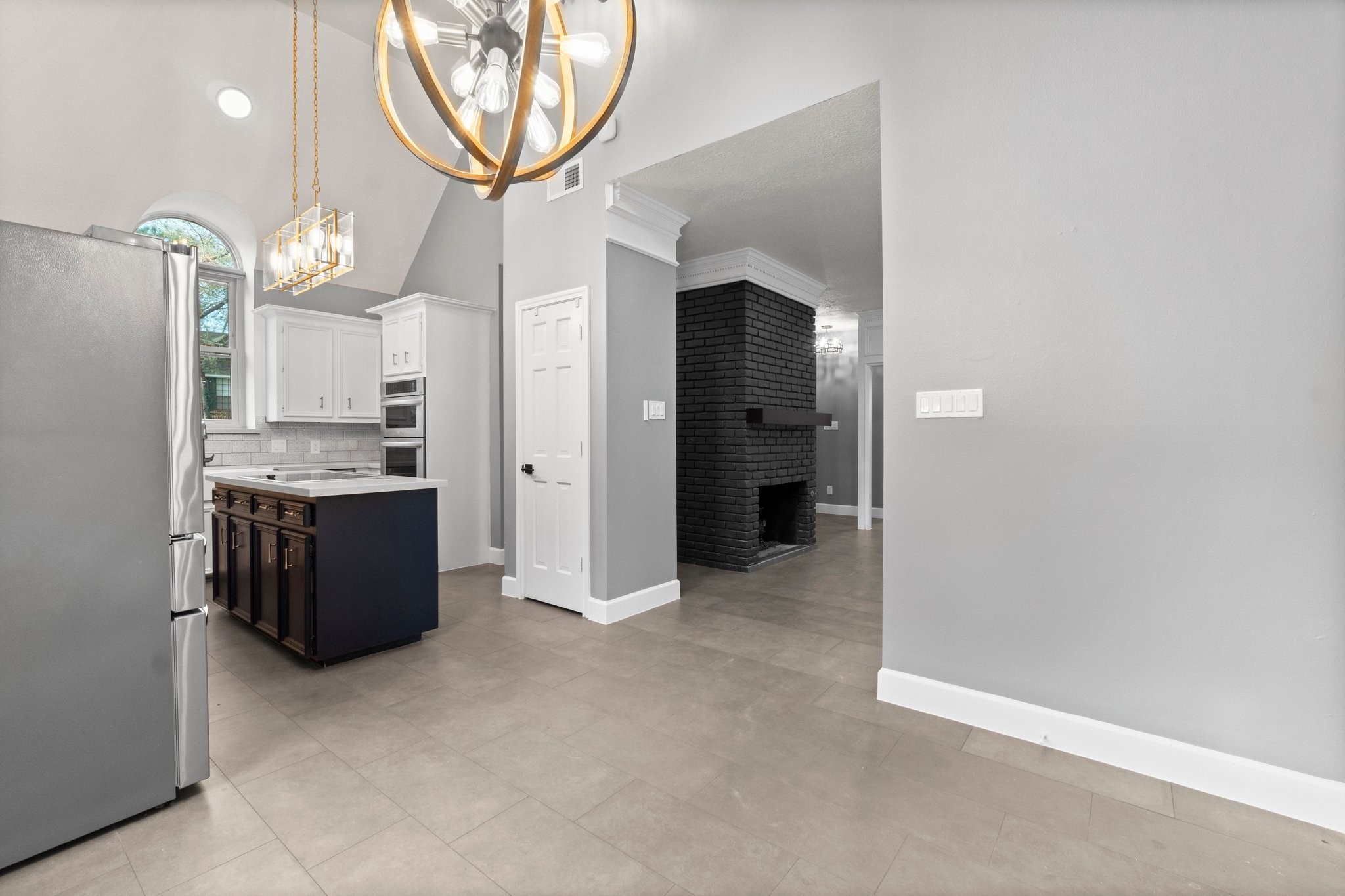 31 Tanager Trail The Woodlands, TX 77381 - Photo 12 of 48 a view of a kitchen with a sink and a mirror