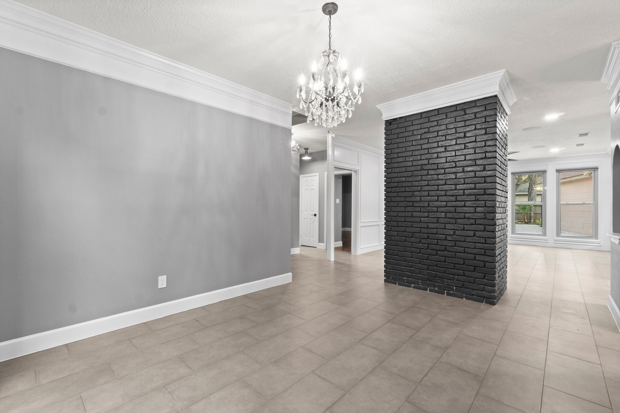 31 Tanager Trail The Woodlands, TX 77381 - Photo 14 of 48 a view of a chandelier in hallway