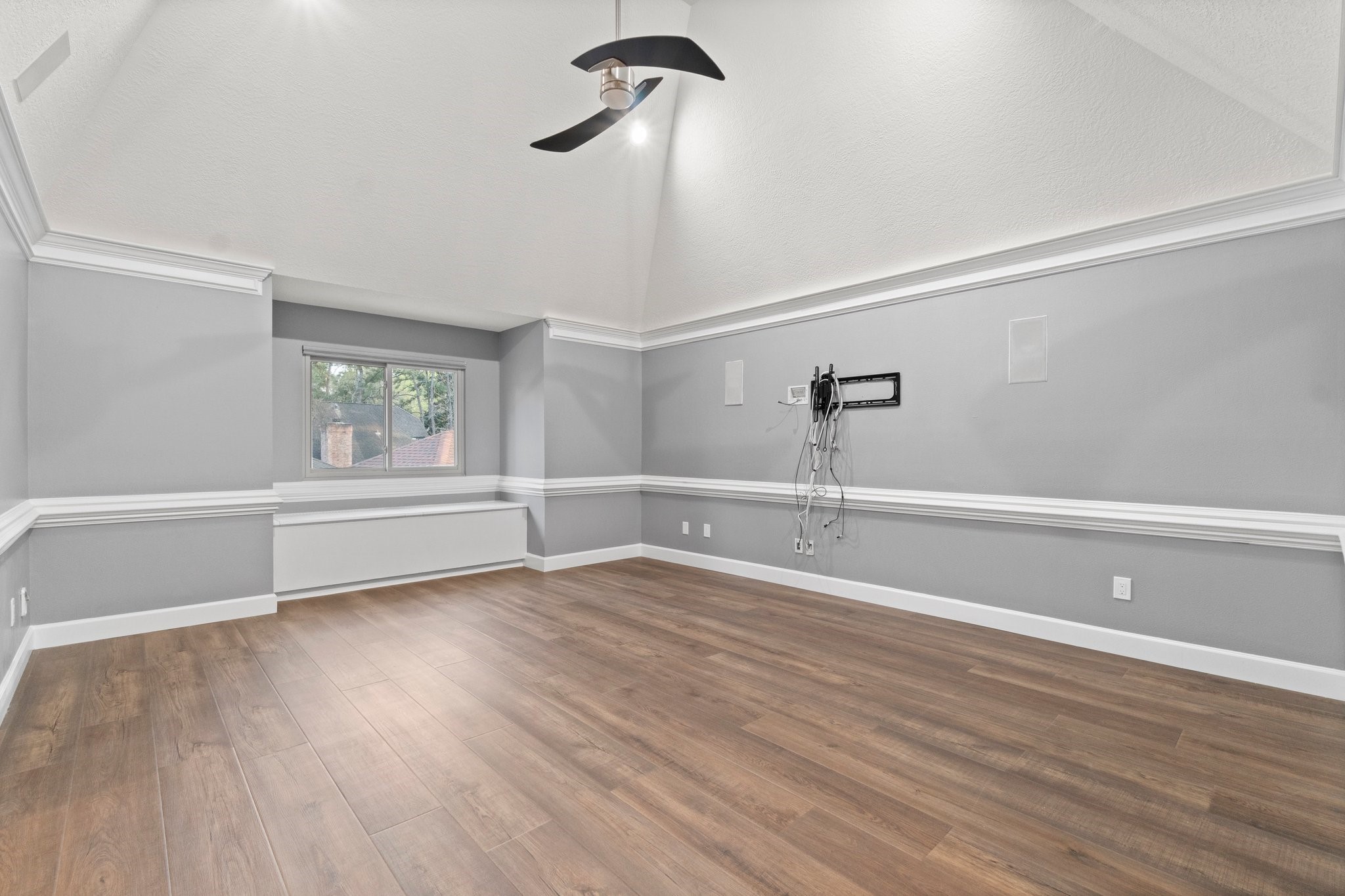 31 Tanager Trail The Woodlands, TX 77381 - Photo 18 of 48 a view of a room with wooden floor and window