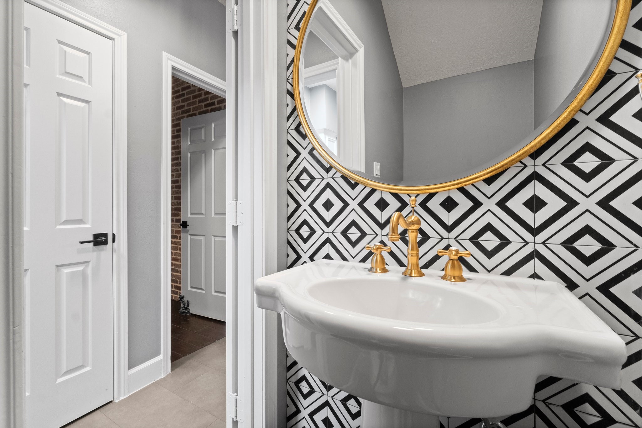 31 Tanager Trail The Woodlands, TX 77381 - Photo 31 of 48 a bathroom with a sink and a mirror