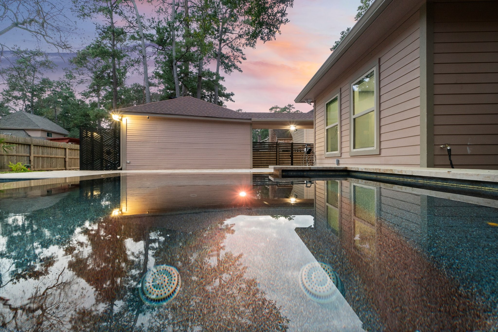 31 Tanager Trail The Woodlands, TX 77381 - Photo 40 of 48 a view of a lake with a house