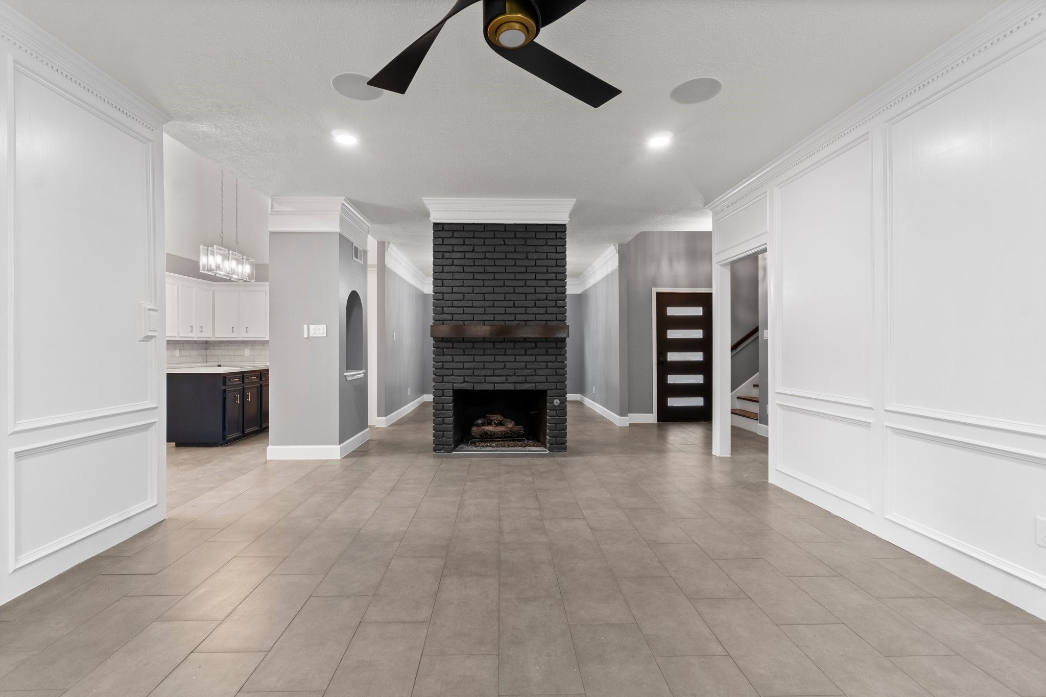 31 Tanager Trail The Woodlands, TX 77381 - Photo 8 of 48 an empty room with a fireplace cabinet and windows
