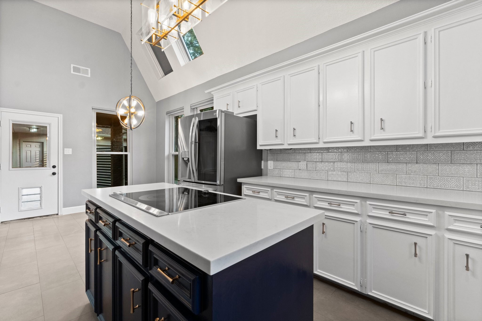 31 Tanager Trail The Woodlands, TX 77381 - Photo 9 of 48 a kitchen with stainless steel appliances granite countertop a sink stove and refrigerator