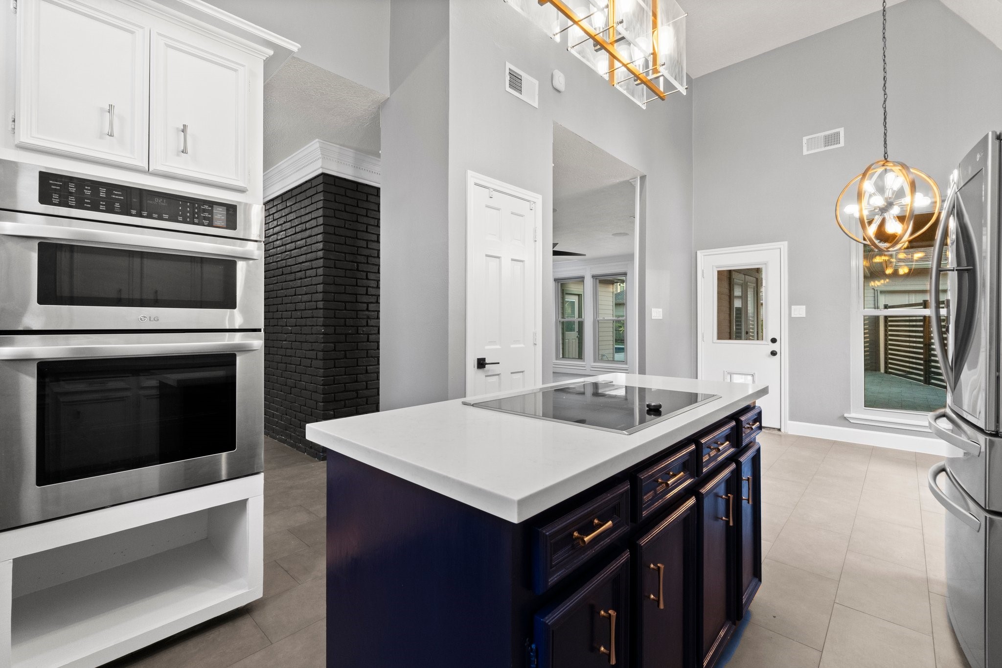 31 Tanager Trail The Woodlands, TX 77381 - Photo 10 of 48 a kitchen with a stove cabinets and wooden floor