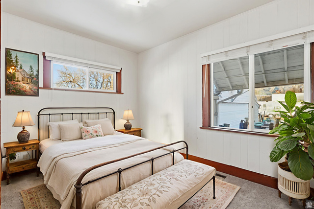 202 Main Street Smithfield, UT 84335 - Photo 14 of 32 Carpeted bedroom featuring baseboards and wooden walls