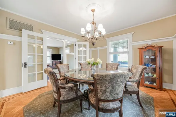 a view of a dining room with furniture and window
