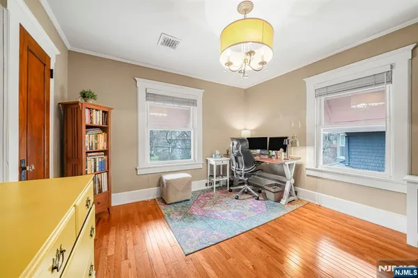 a living room with furniture a fireplace and a table