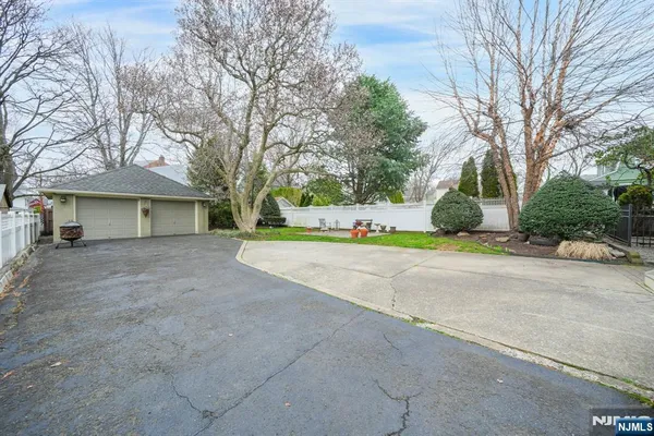 a view of a house with a yard and garage