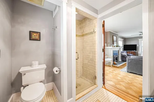 a bathroom with a toilet sink and a shower