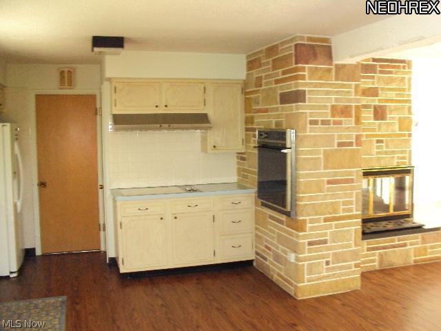 Another view of kitchen plus part of the fireplace/room divider