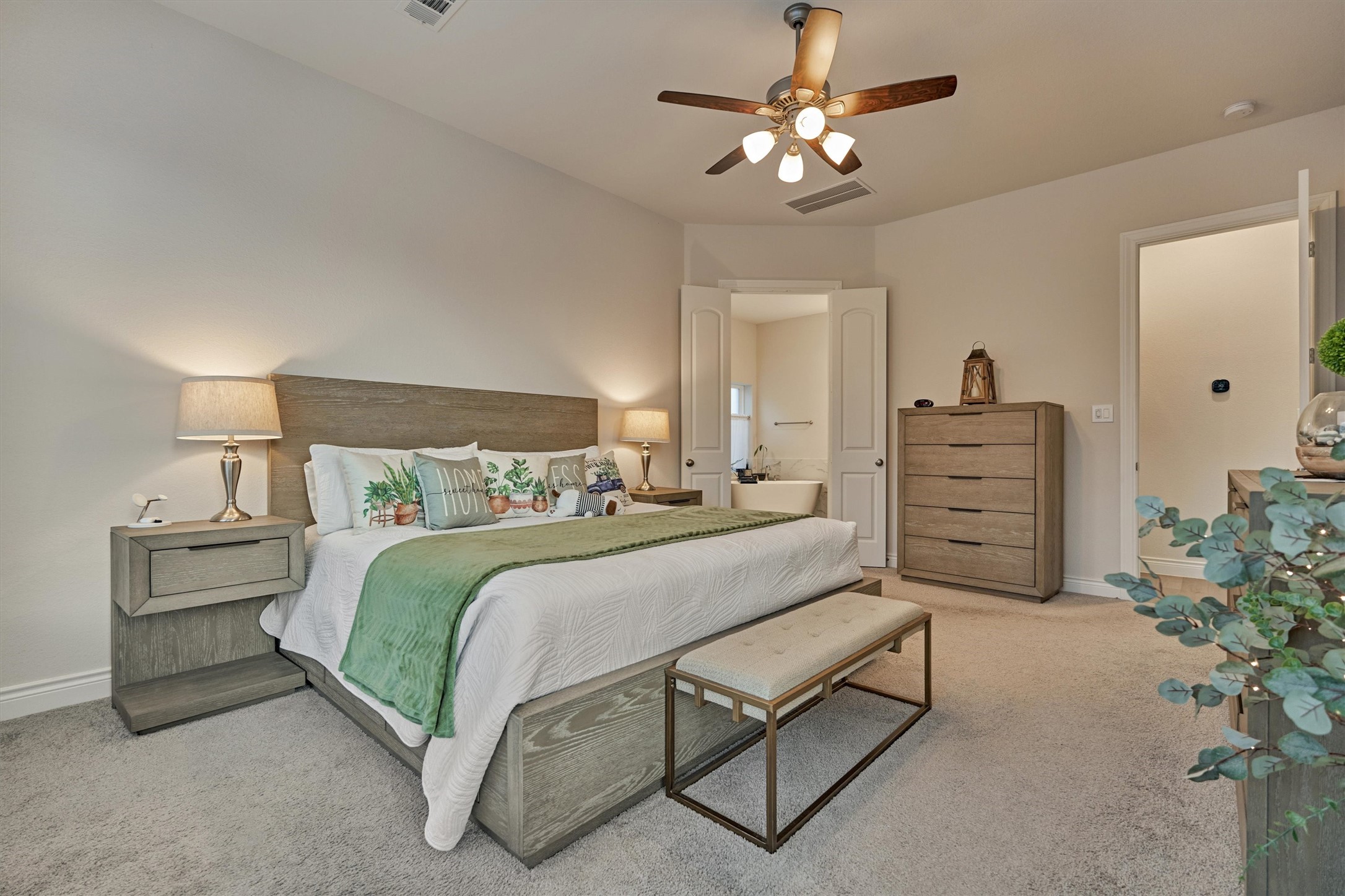 15230 Tree Swallow Court Magnolia, TX 77354 - Photo 24 of 49 a bedroom with a bed chandelier and dresser