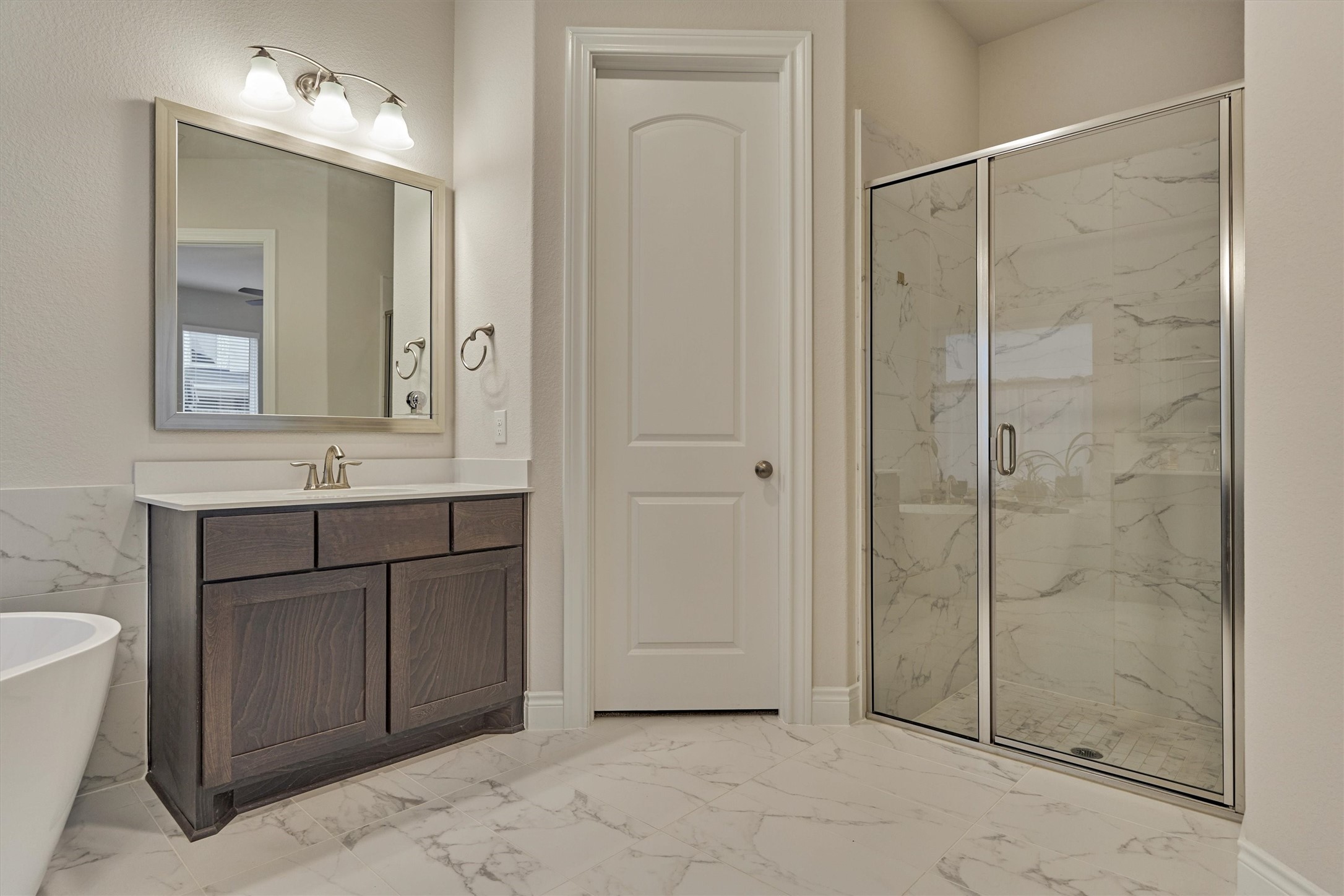 15230 Tree Swallow Court Magnolia, TX 77354 - Photo 27 of 49 a bathroom with a shower sink and mirror