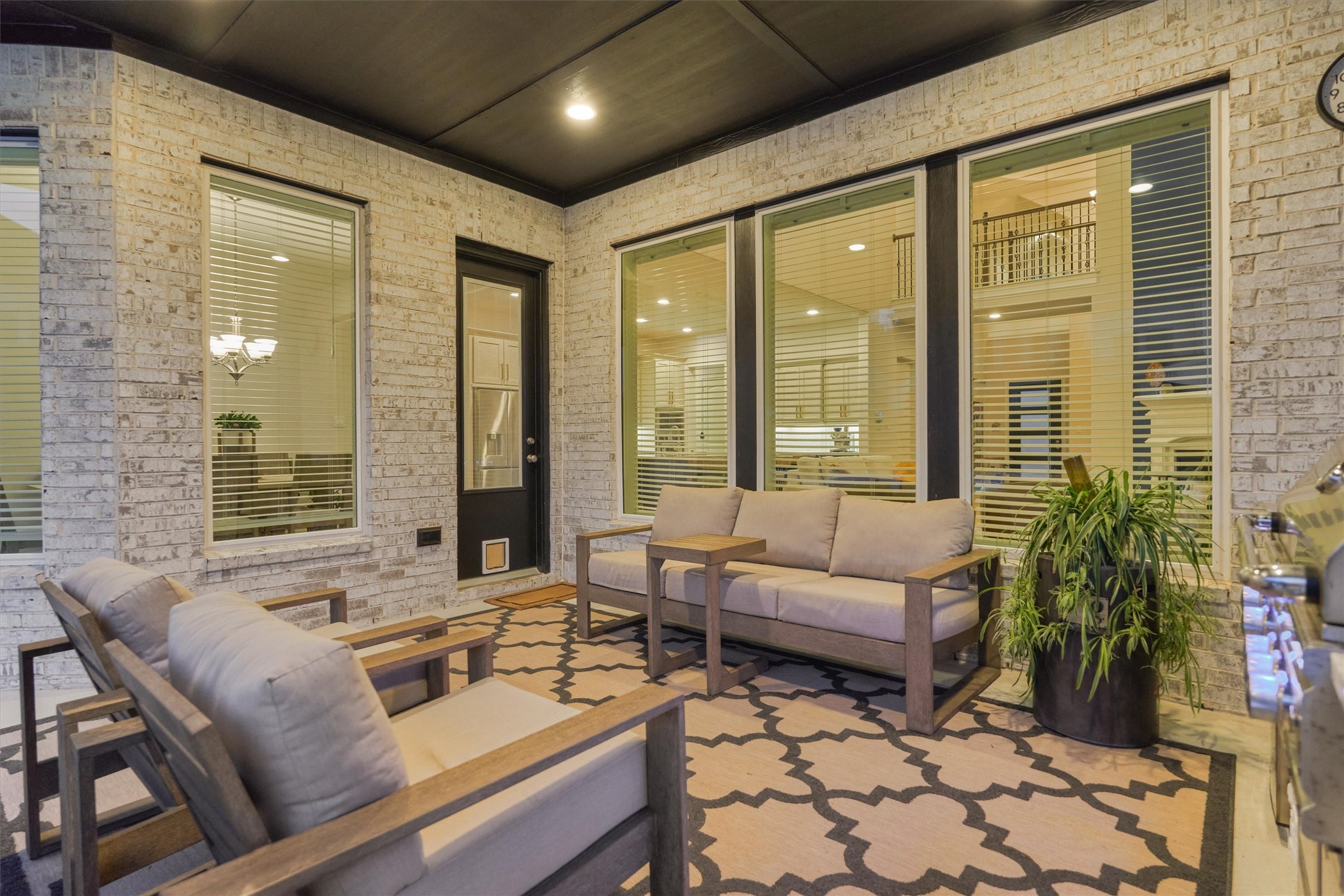 15230 Tree Swallow Court Magnolia, TX 77354 - Photo 44 of 49 a living room with furniture and floor to ceiling windows
