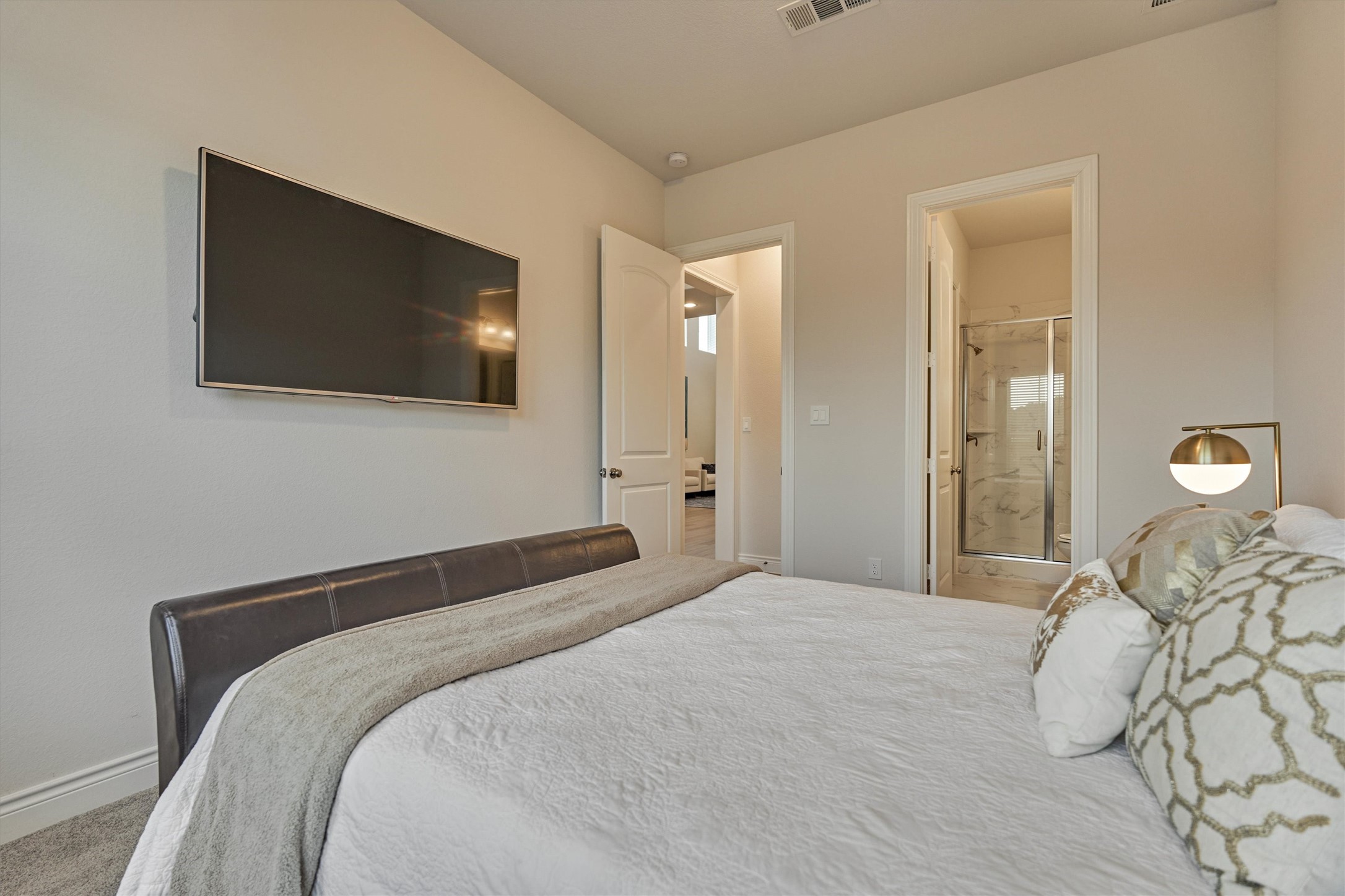 15230 Tree Swallow Court Magnolia, TX 77354 - Photo 9 of 49 a bedroom with a bed and a flat screen tv