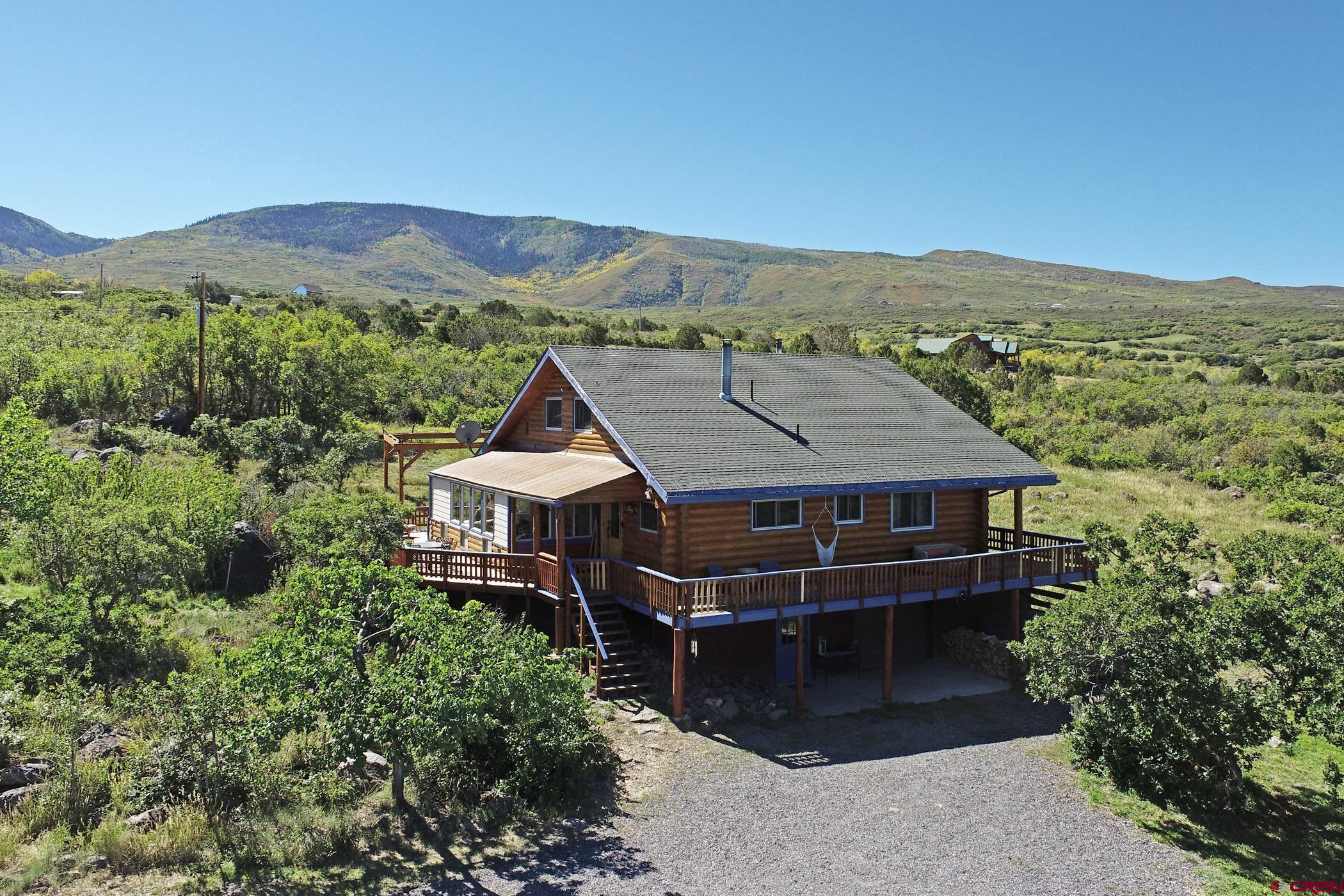 9321 54 Road Molina, CO 81646 - Photo 1 of 32 an aerial view of a house next to a yard