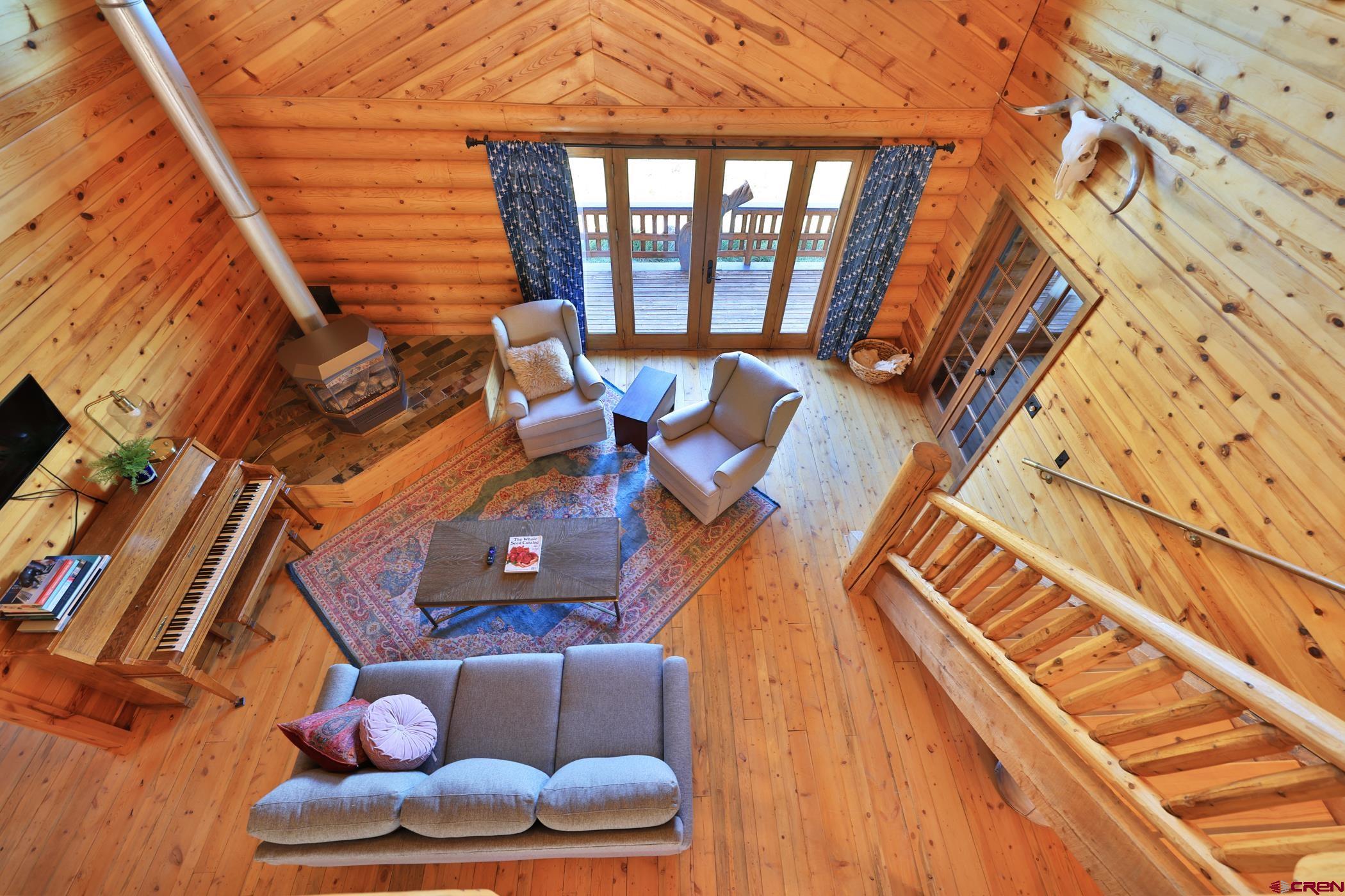 9321 54 Road Molina, CO 81646 - Photo 11 of 32 a living room with furniture and a floor to ceiling window