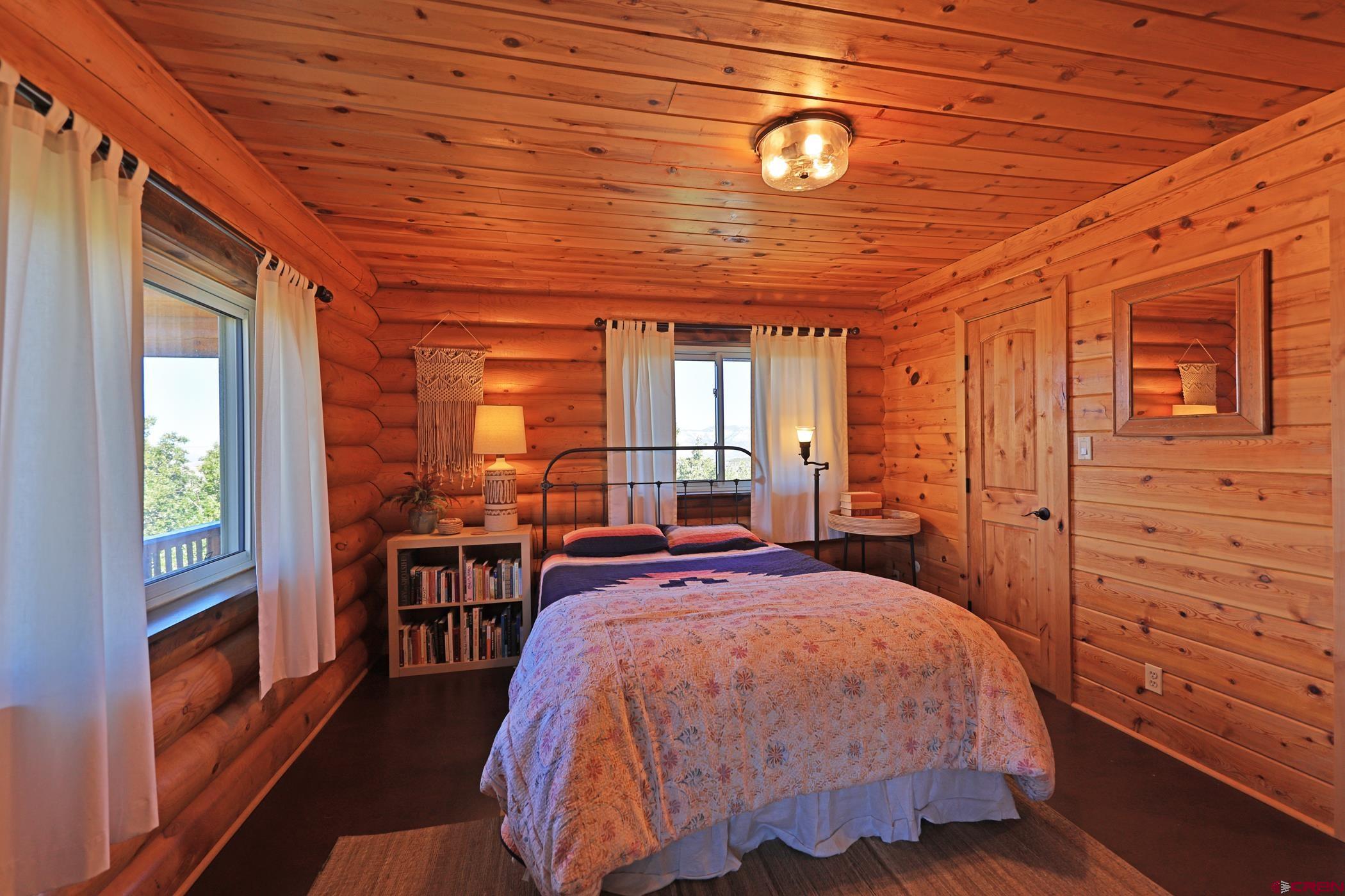 9321 54 Road Molina, CO 81646 - Photo 15 of 32 a bed room with a bed and a window