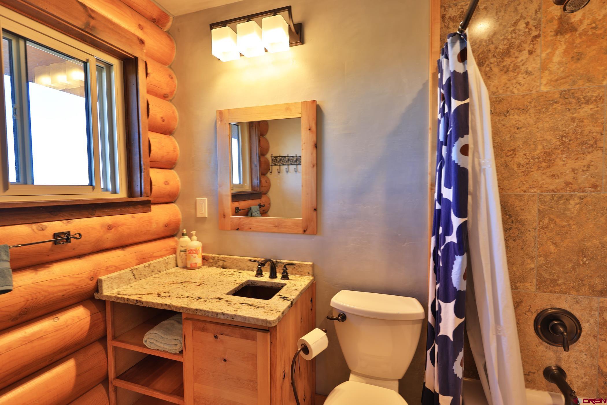 9321 54 Road Molina, CO 81646 - Photo 16 of 32 a bathroom with a sink and a mirror