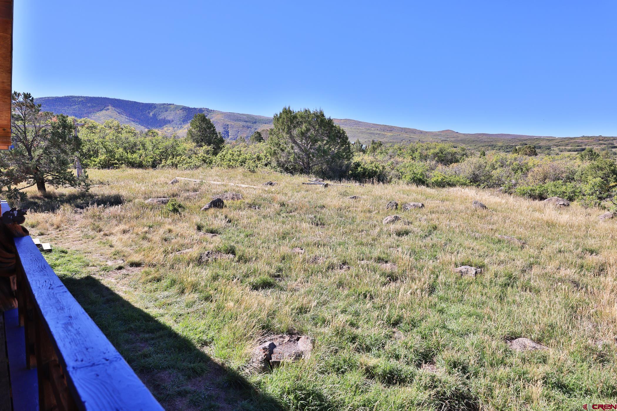 9321 54 Road Molina, CO 81646 - Photo 25 of 32 a view of a dry yard with wooden fence