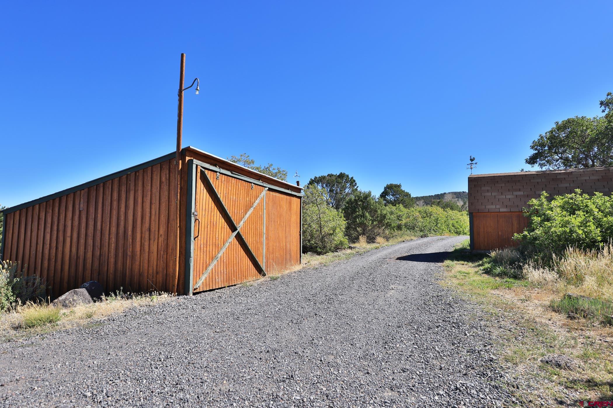 9321 54 Road Molina, CO 81646 - Photo 26 of 32 a backyard of a house with a tree