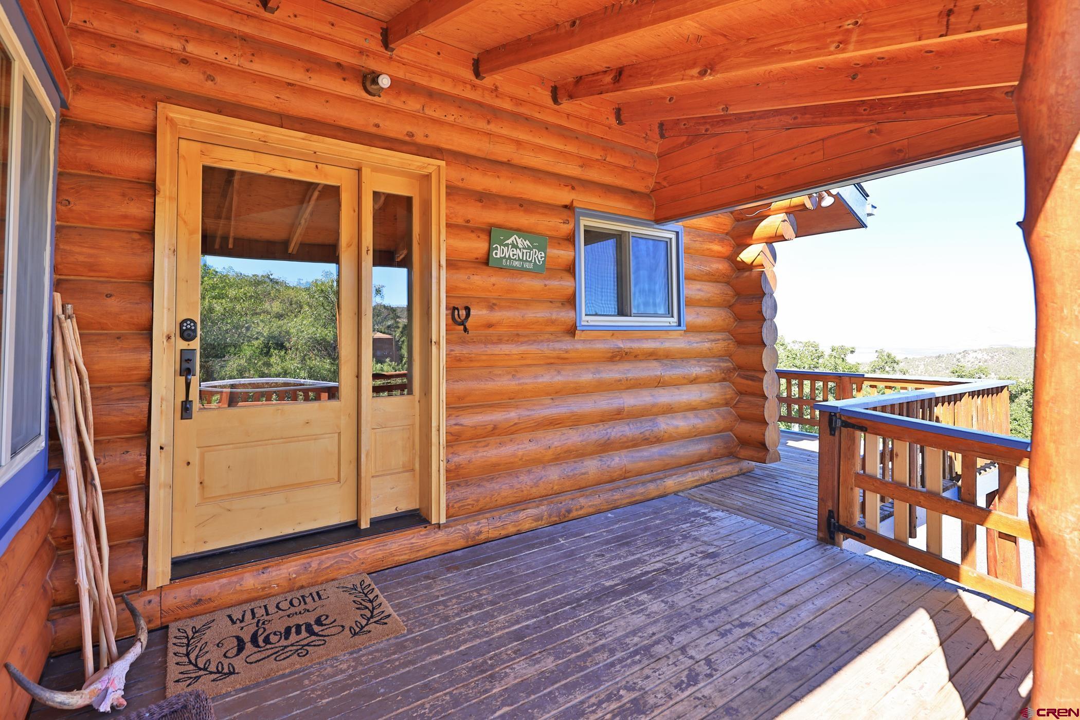9321 54 Road Molina, CO 81646 - Photo 4 of 32 a view of a porch with wooden floor and outdoor space