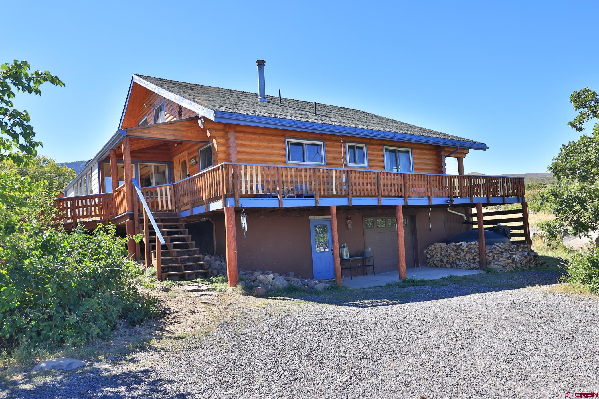 9321 54 Road Molina, CO 81646 - Photo 32 of 32 a front view of a house with a yard