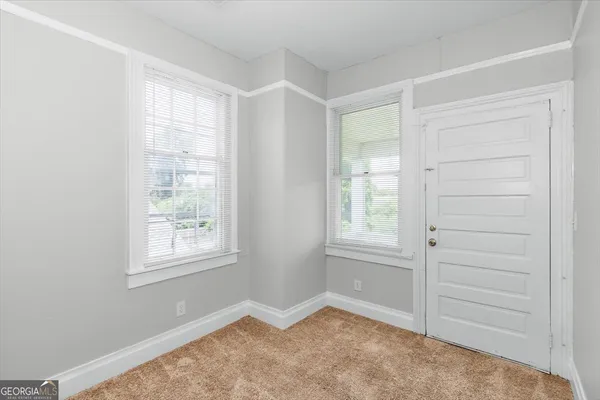 an empty room with windows