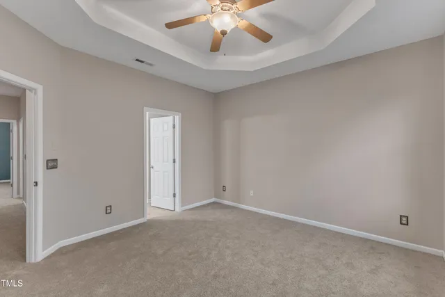a bathroom with a double vanity sink mirror and toilet